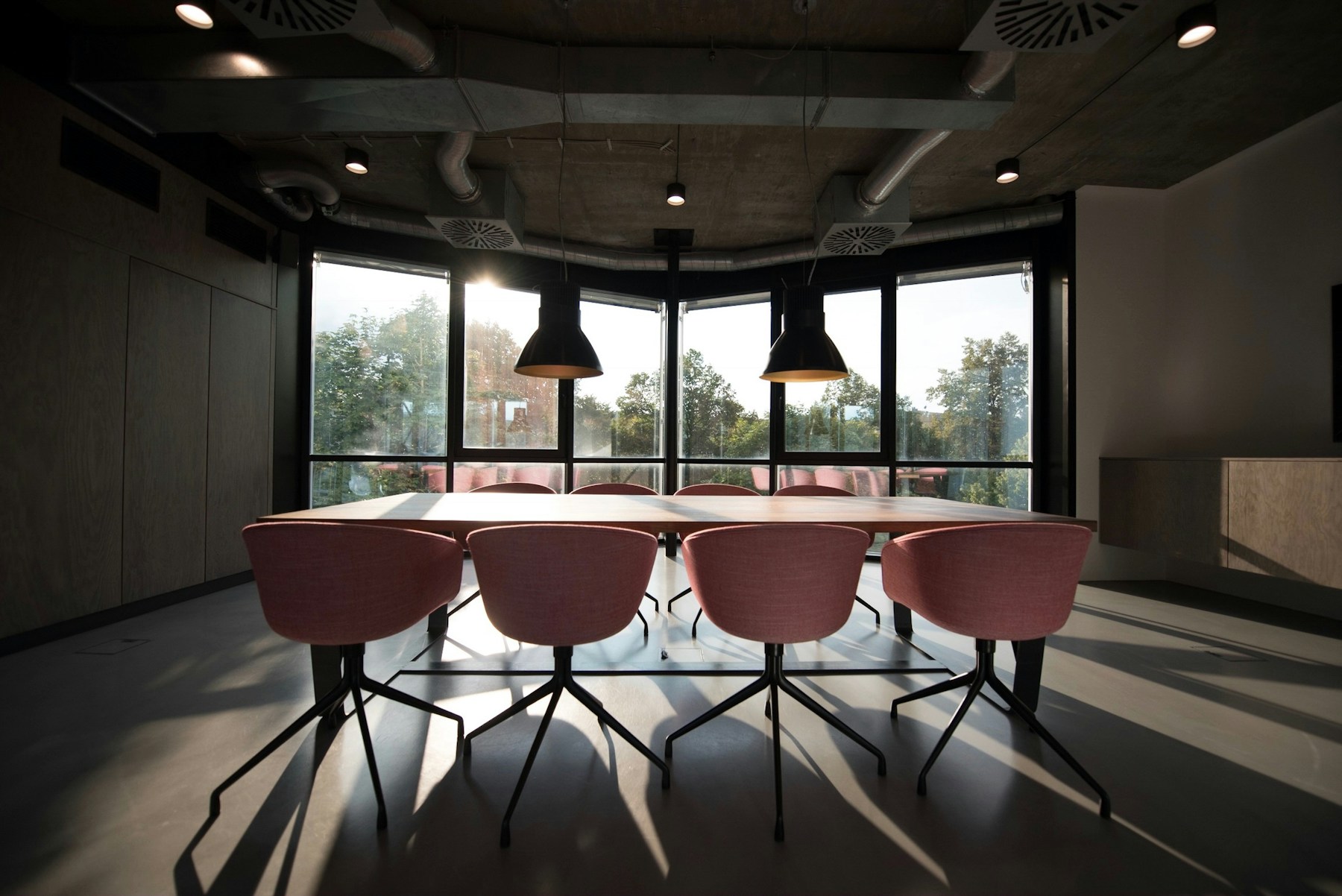 Commercial boardroom featuring custom joinery and a large meeting table