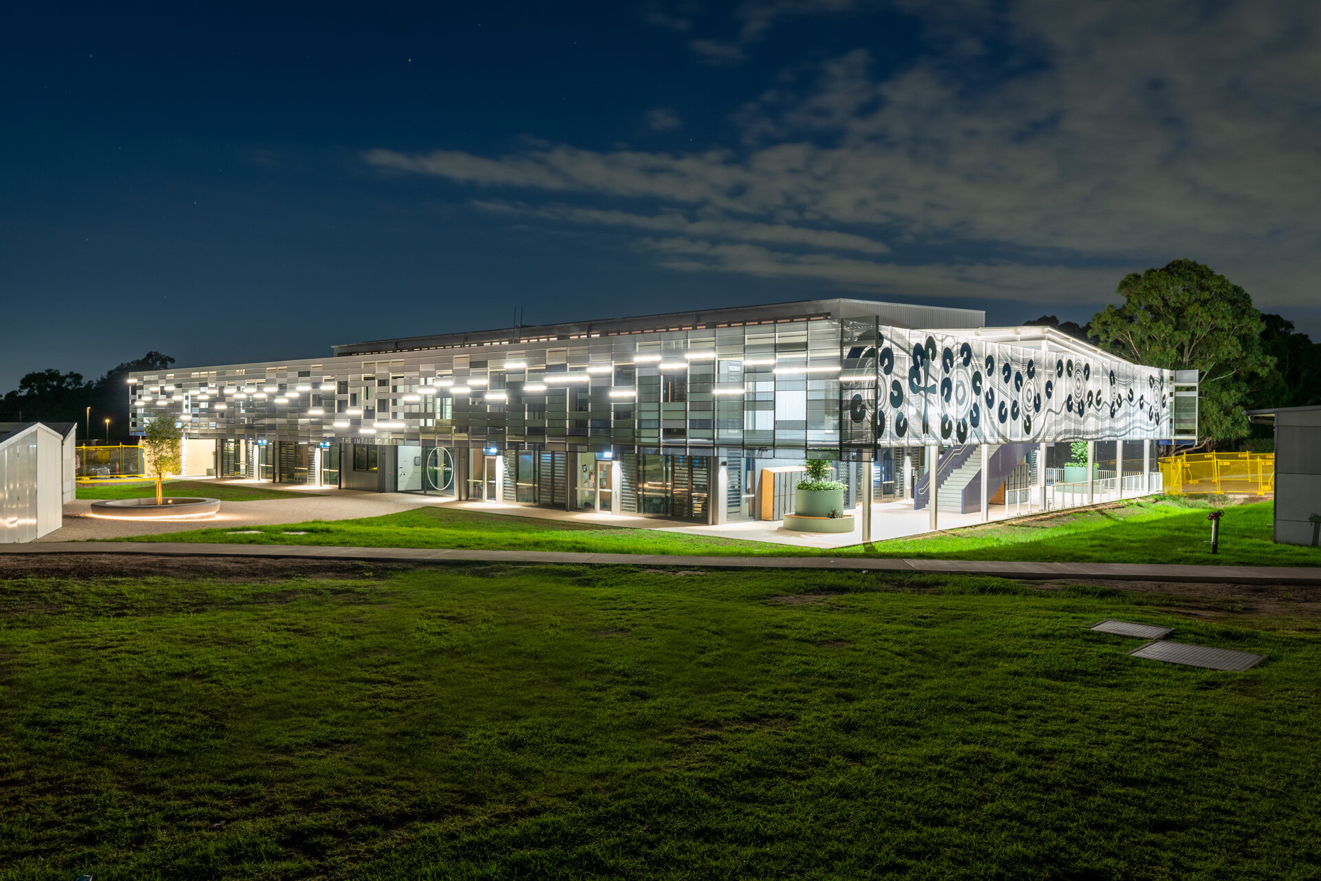Illuminated MPAC commercial building exterior at night