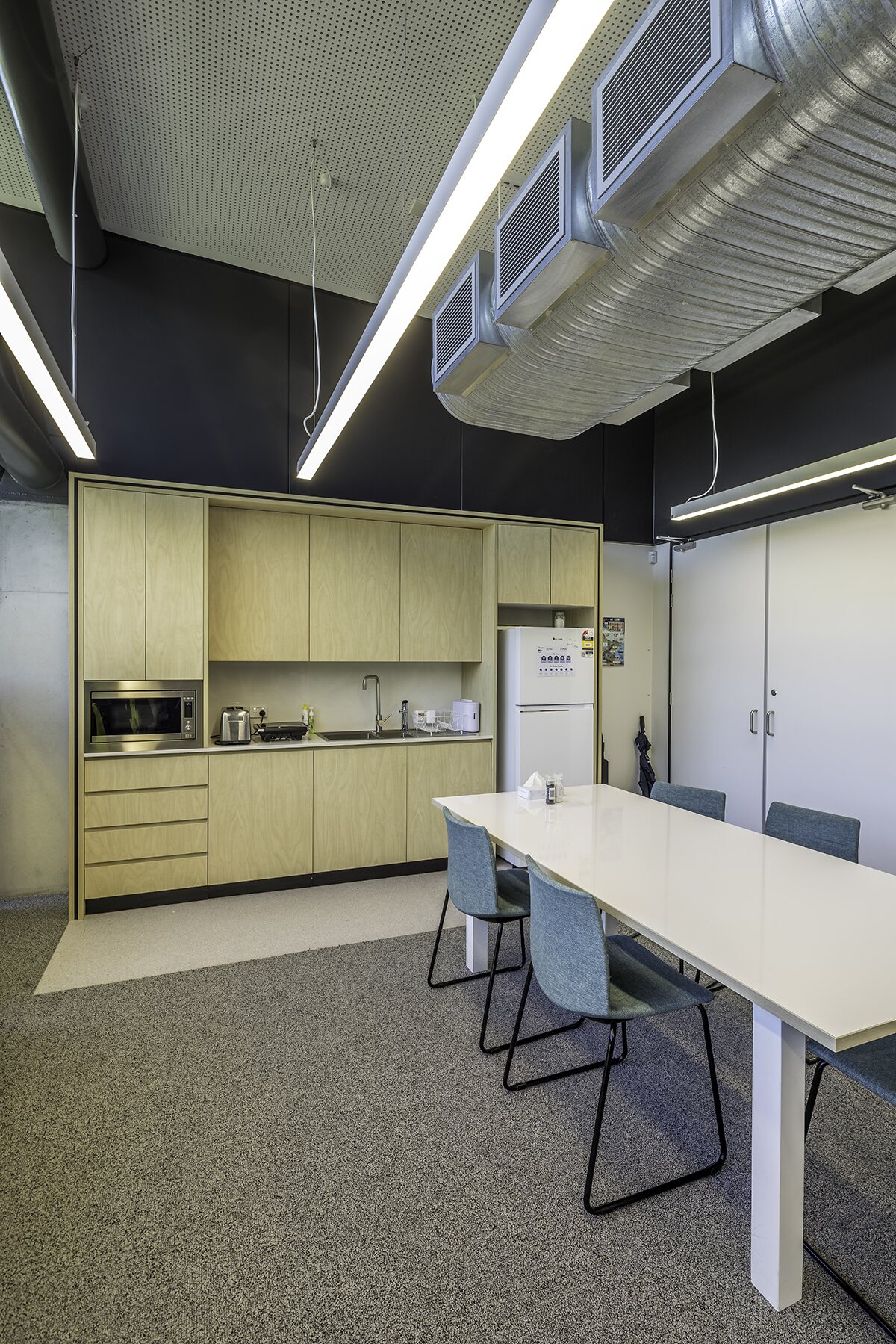 Custom timber kitchen joinery in a commercial staff room