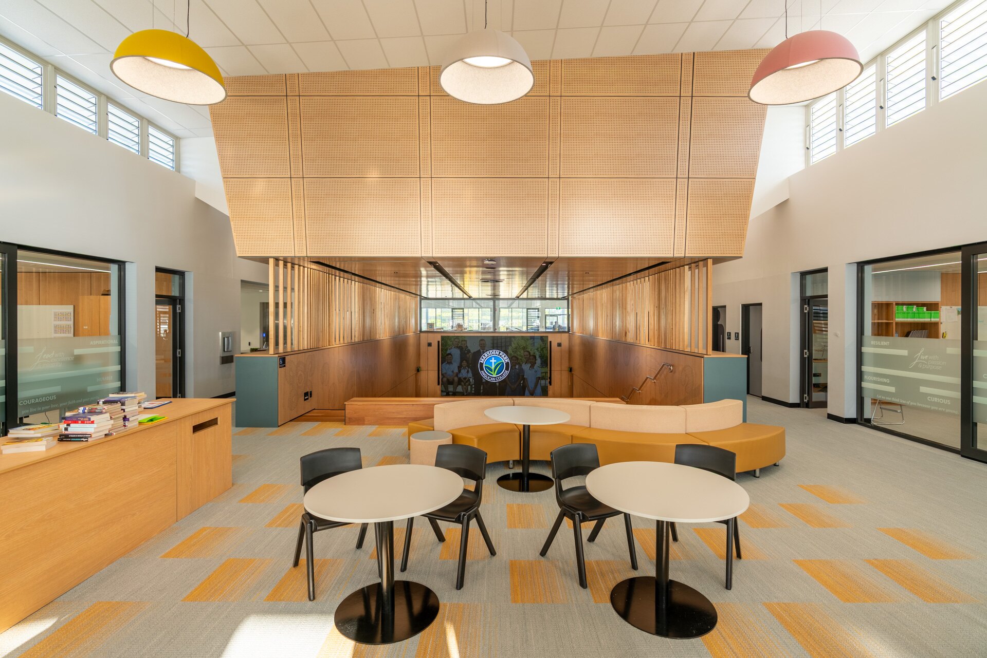 Open learning commons with timber joinery and integrated seating at Marsden Park Anglican College
