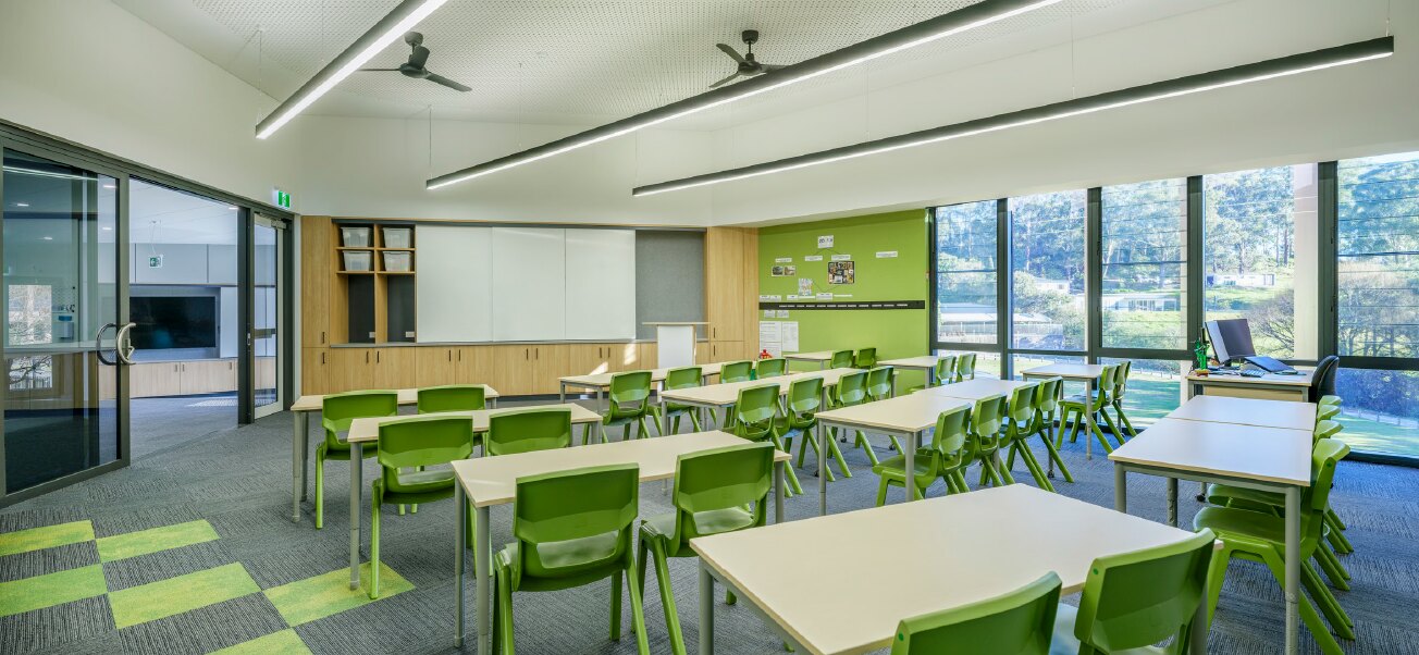 Wide Terrigal classroom with custom timber cabinetry and green learning furniture