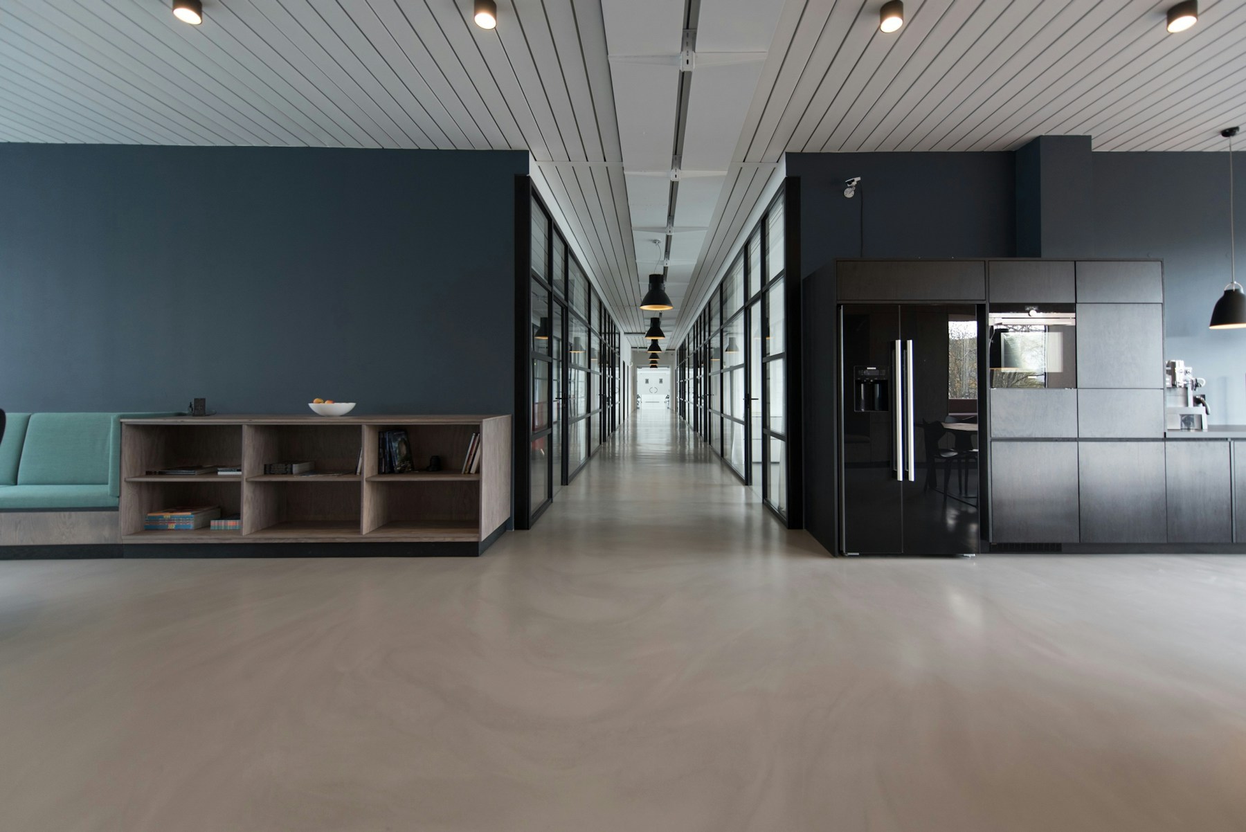 Contemporary commercial office fitout with custom dark cabinetry